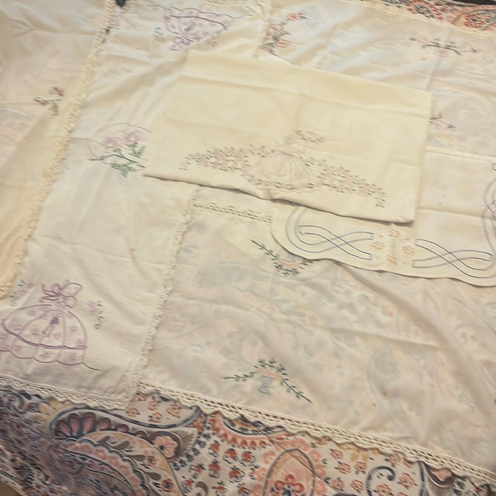 7 cross stitched, various sized liners and dollies